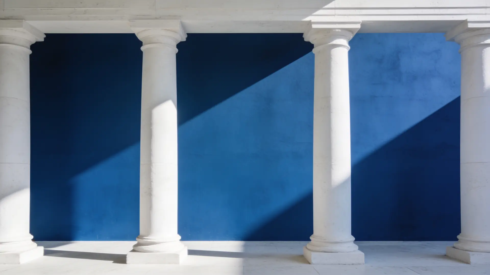 White stone columns casting shadows on a blue wall — illustrative image for regulation in Singapore